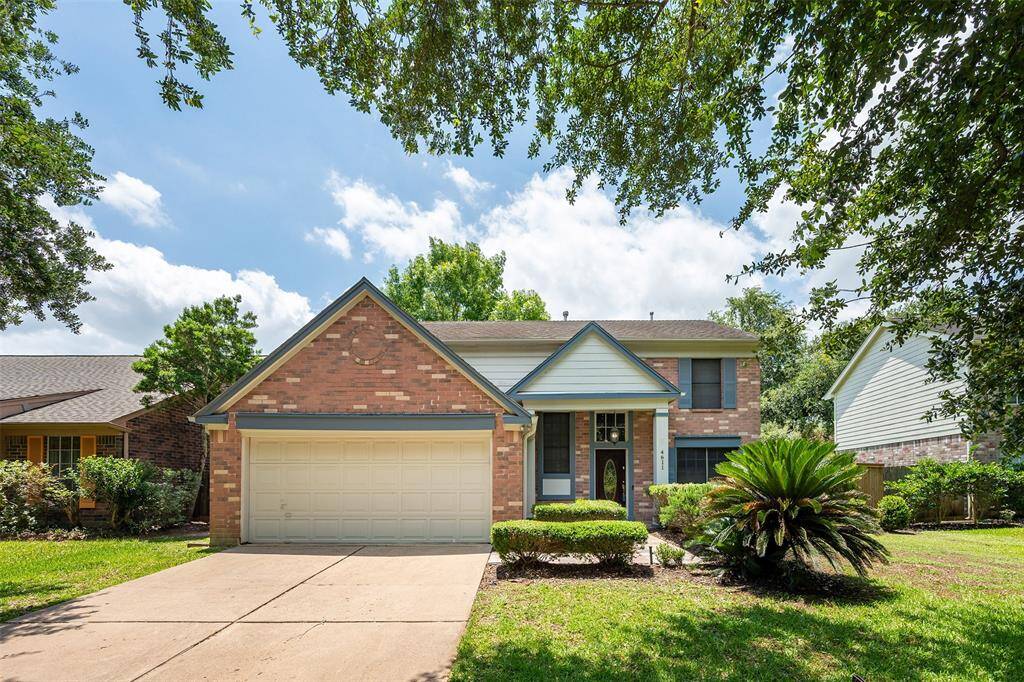 Welcome to 4611 Wolverhampton Way! Located in a quiet neighborhood, this two-story brick home offers easy to maintain landscaping, a spacious double-wide driveway, and a mature tree providing welcoming shade.