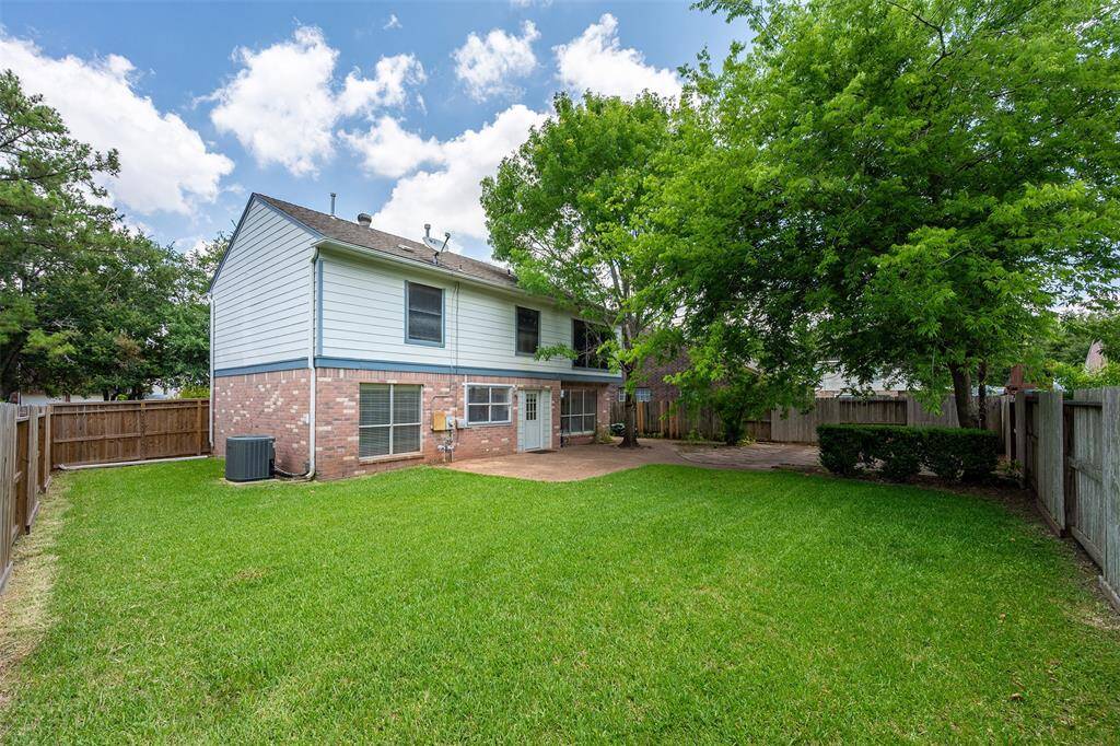 Spacious backyard with paved patio - perfect for entertaining or unwinding.