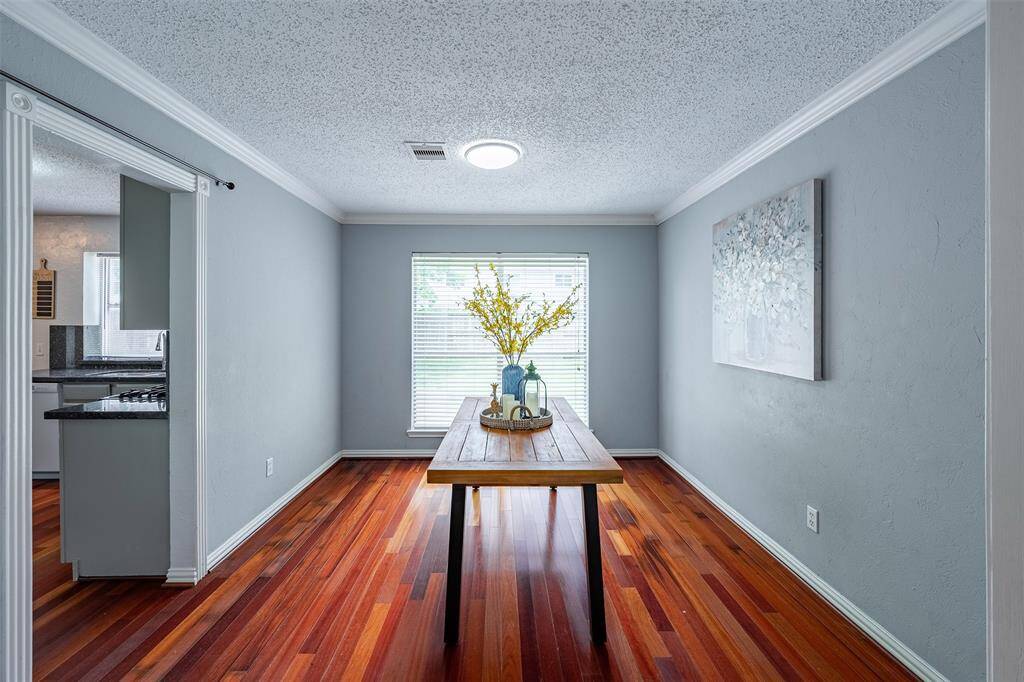 The formal dining room flows effortlessly into the kitchen, family room, and living room.