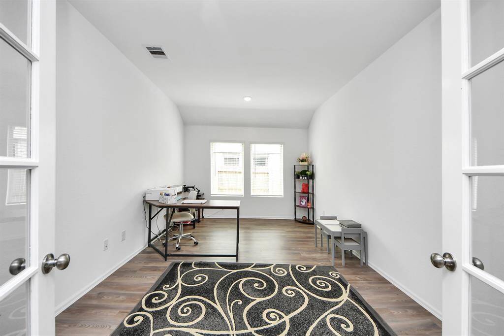 French doors allow for private office.