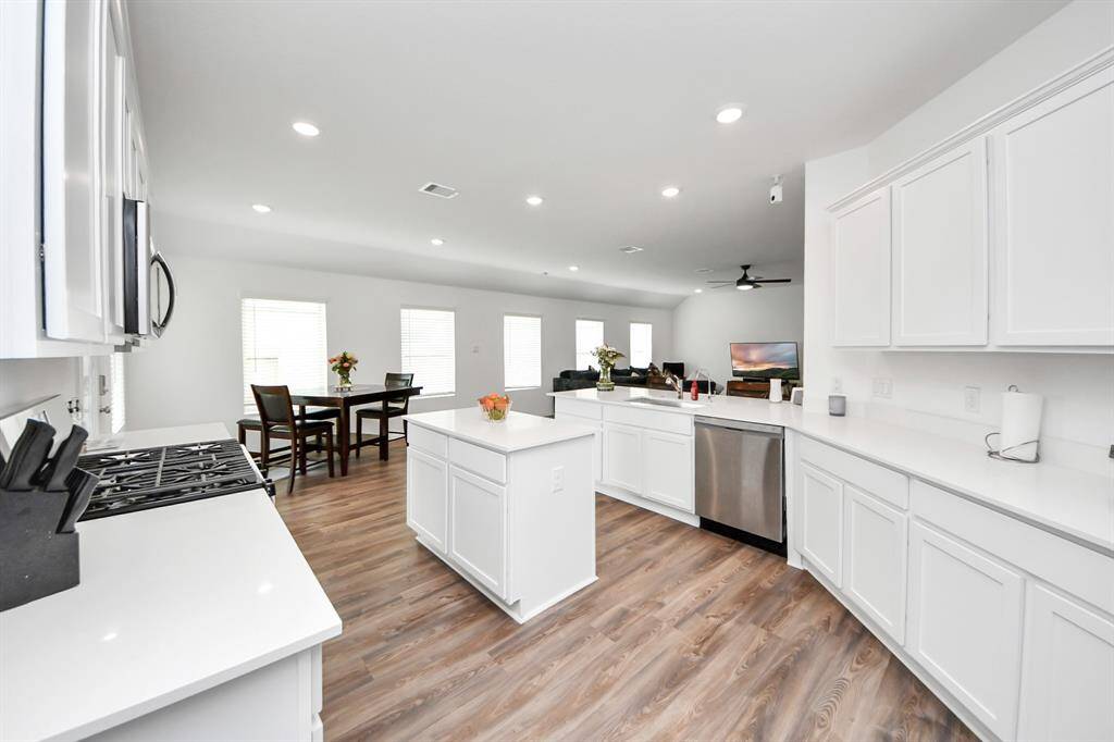 Large kitchen island for extra storage and countertop space.