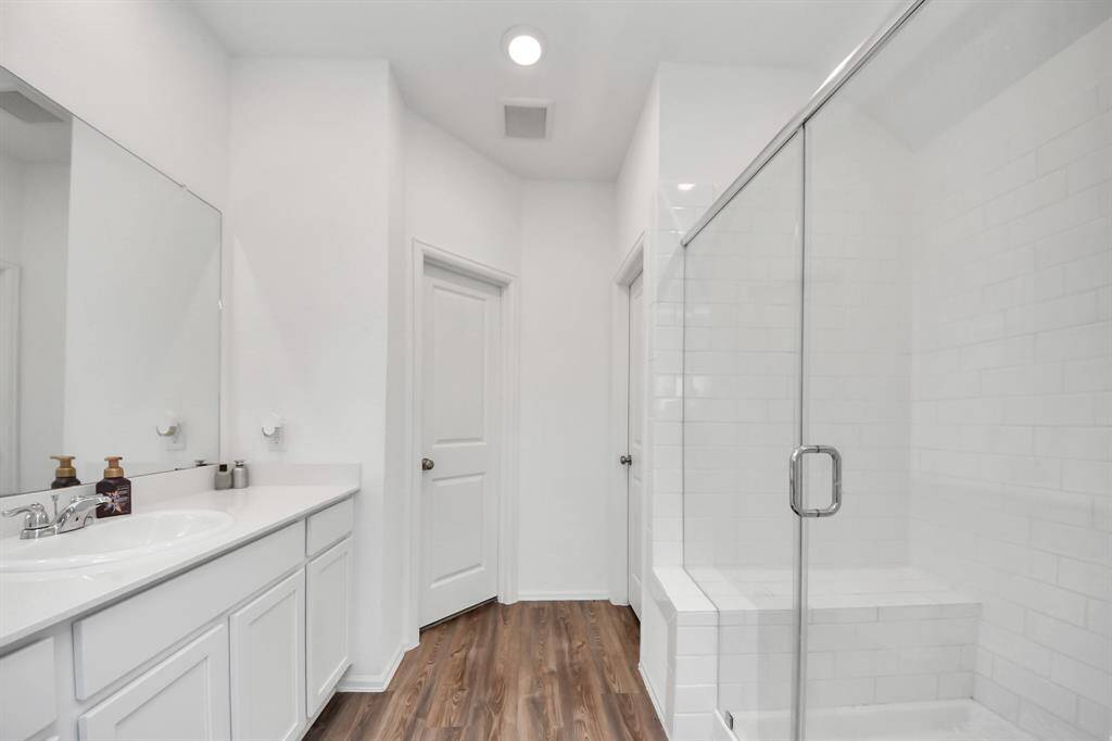 Primary bathroom with walk in closet.