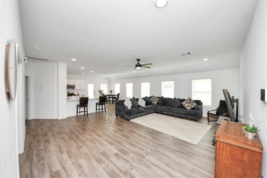 Living room open to kitchen and dinning area.