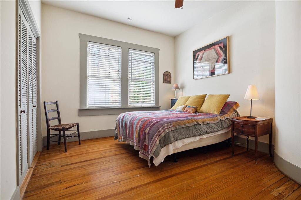 The third bedroom offers a quiet retreat with soft natural light and beautiful hardwood floors.