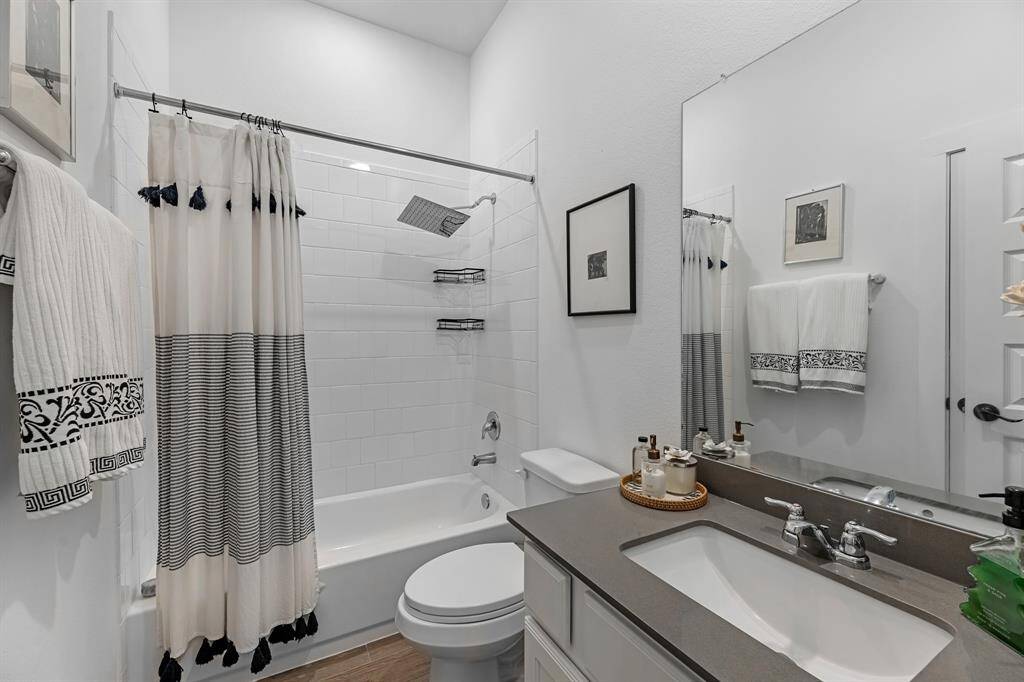 Full secondary bathroom downstairs features Rainfall Shower Head.