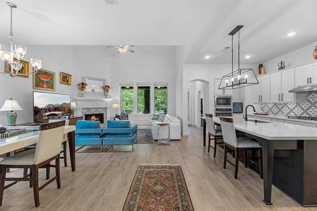 Open concept features the dinning area, breakfast bar, kitchen, and living room.