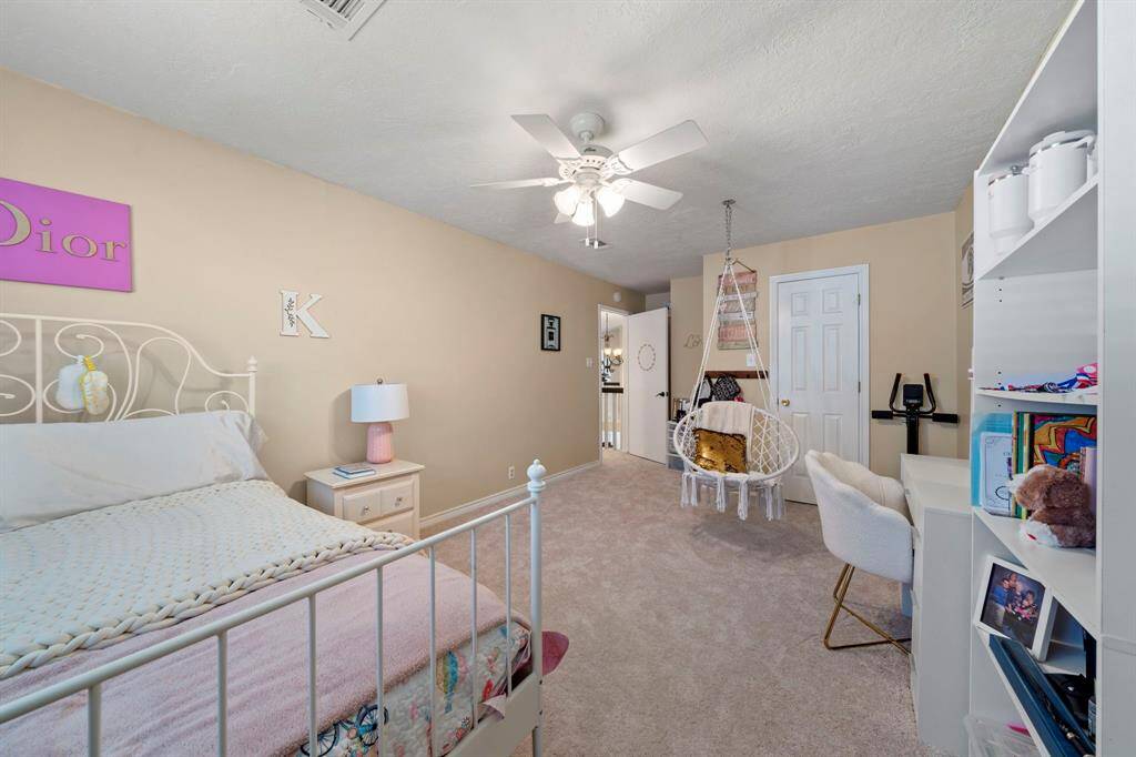 Second bedroom is huge and includes a walk-in closet, new carpet, fan and lots of extra space.