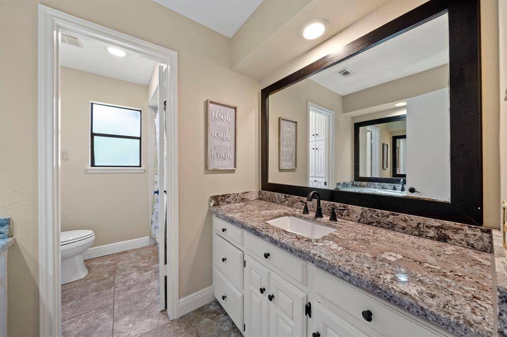This is the upstairs bathroom has sinks and mirrors on both sides with lots of vanity space.