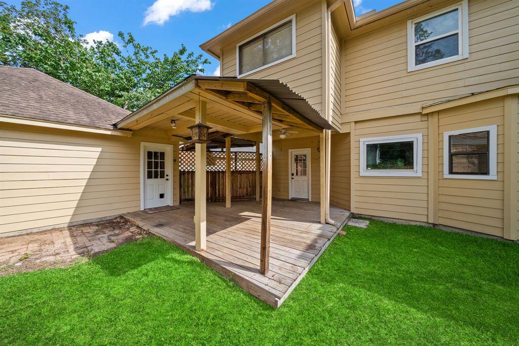 The covered patio with wooden deck is really nice for outdoor relaxation and entertaining.