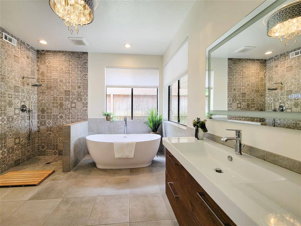 So spa like with floating cabinets, lighted mirror and gorgeous chandelier.