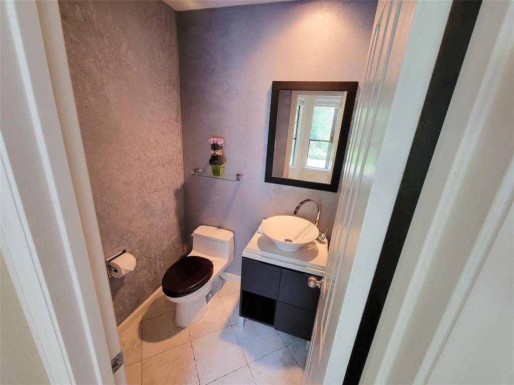 First floor powder room is next to the study.