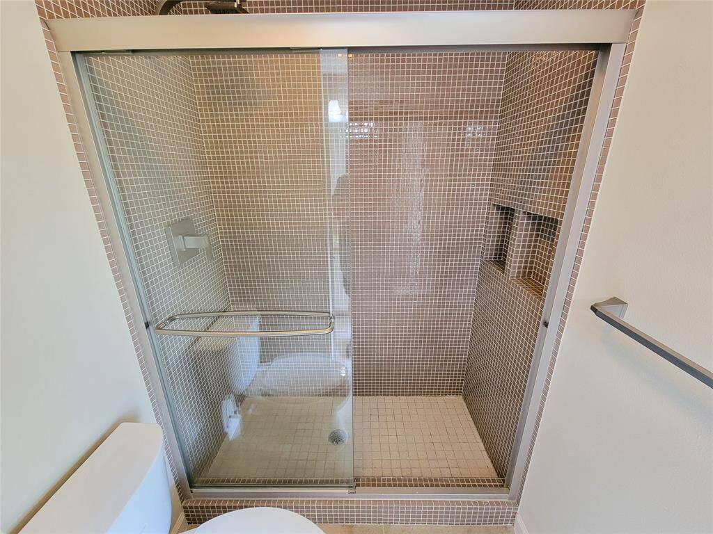 Another view of one of the second floor guest bathrooms with standing shower.