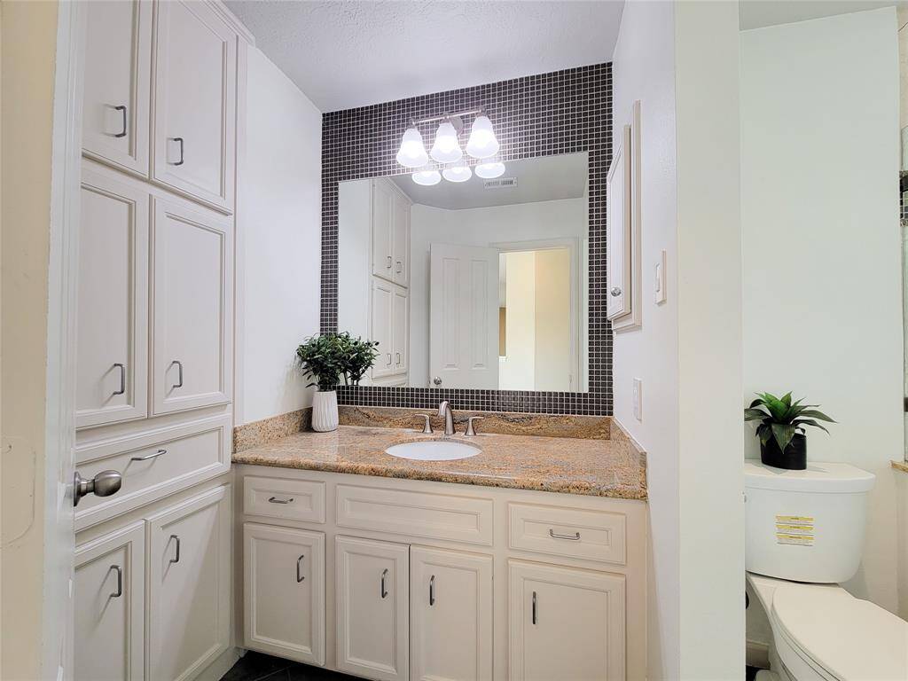 Jack and Jill style second floor guest bath is off the hall near two of the secondary bedrooms.