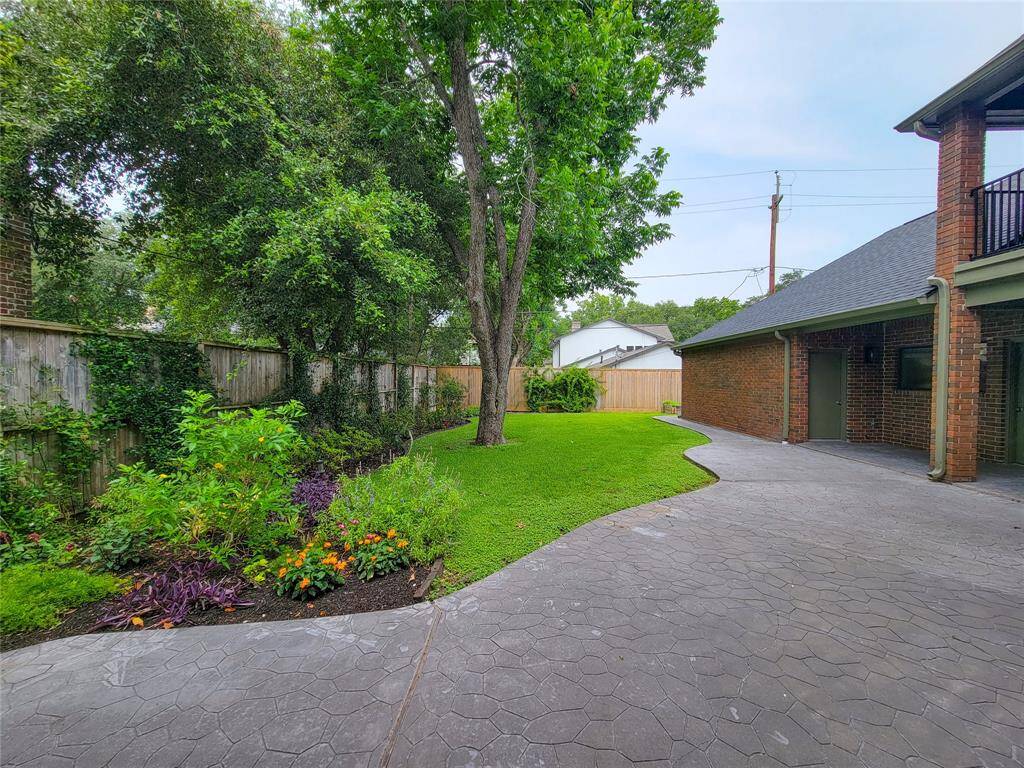 Poured and stamped concrete patios with lovely view of the gardens.