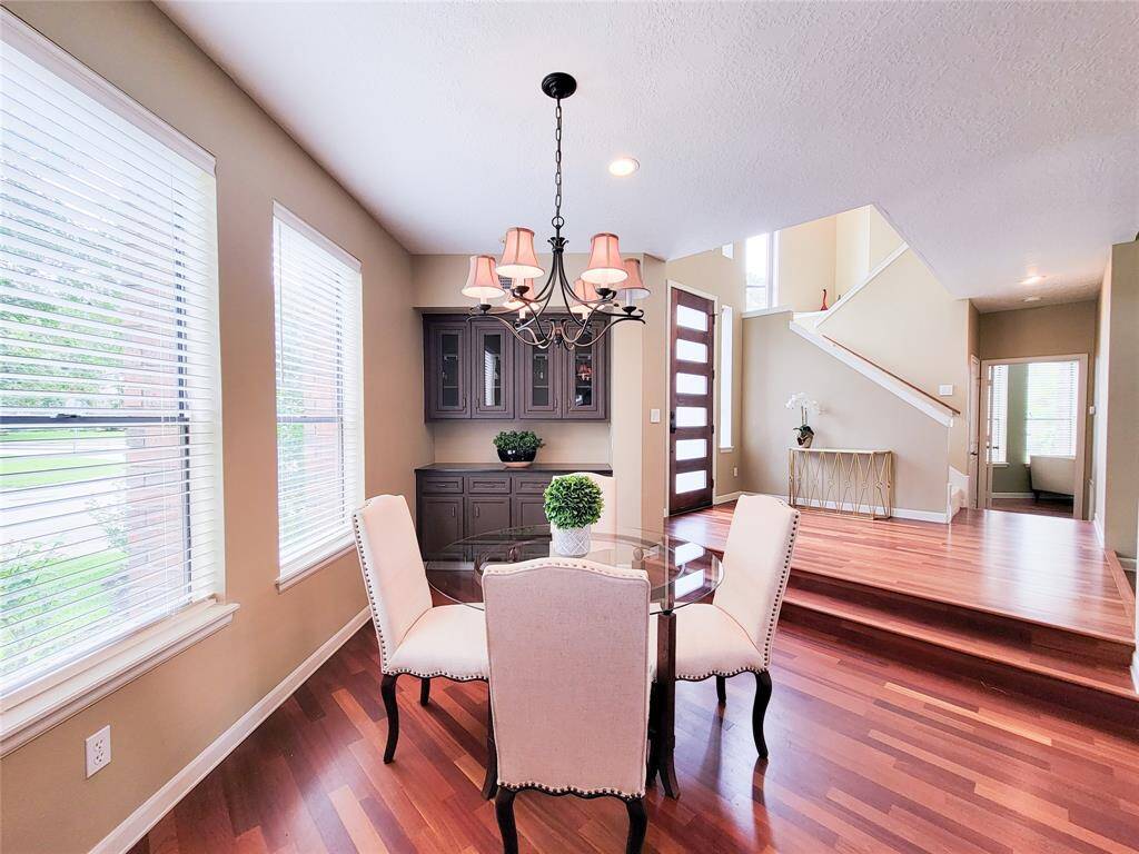 A stunning built-in buffet elevates this formal dining room, offering both elegance and functionality. Perfect for entertaining, with ample storage and sophisticated design elements that enhance the space’s refined ambiance.