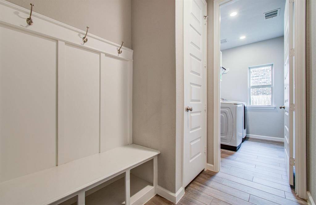 Step into a sophisticated home office through classic French doors, offering privacy and style. This versatile space is ideal for remote work, study, or creative pursuits, with ample room for bookshelves, tech, and inspiration.