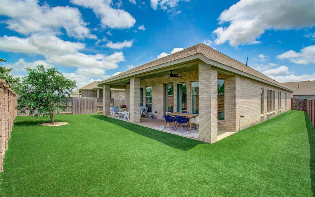Enjoy outdoor living at its finest with an extended covered patio, perfect for morning coffee, entertaining guests, or simply unwinding with a glass of wine.