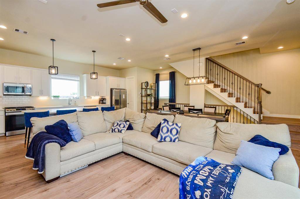 What an amazing, satisfying view, under 11 feet ceilings, from kitchen and living areas, with the gorgeous staircase as a work of art, in itself!