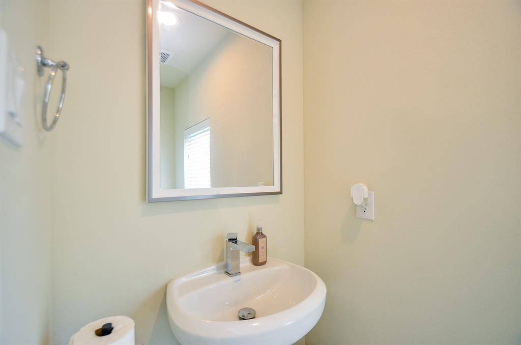 Even the darling half bath located on the second floor with petite sink has personality!