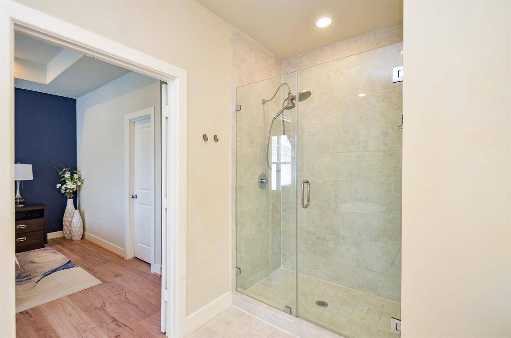 Luxurious bedtime and bathing space are just footsteps away from each other.