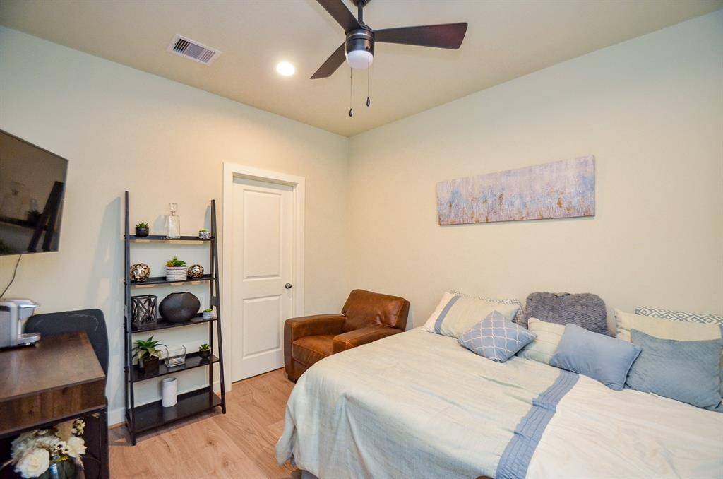 Bedrooms (with Swiss wood flooring) are generous, indeed! This secondary bedroom located on the first floor easily invites bedding and accents of good sizes.