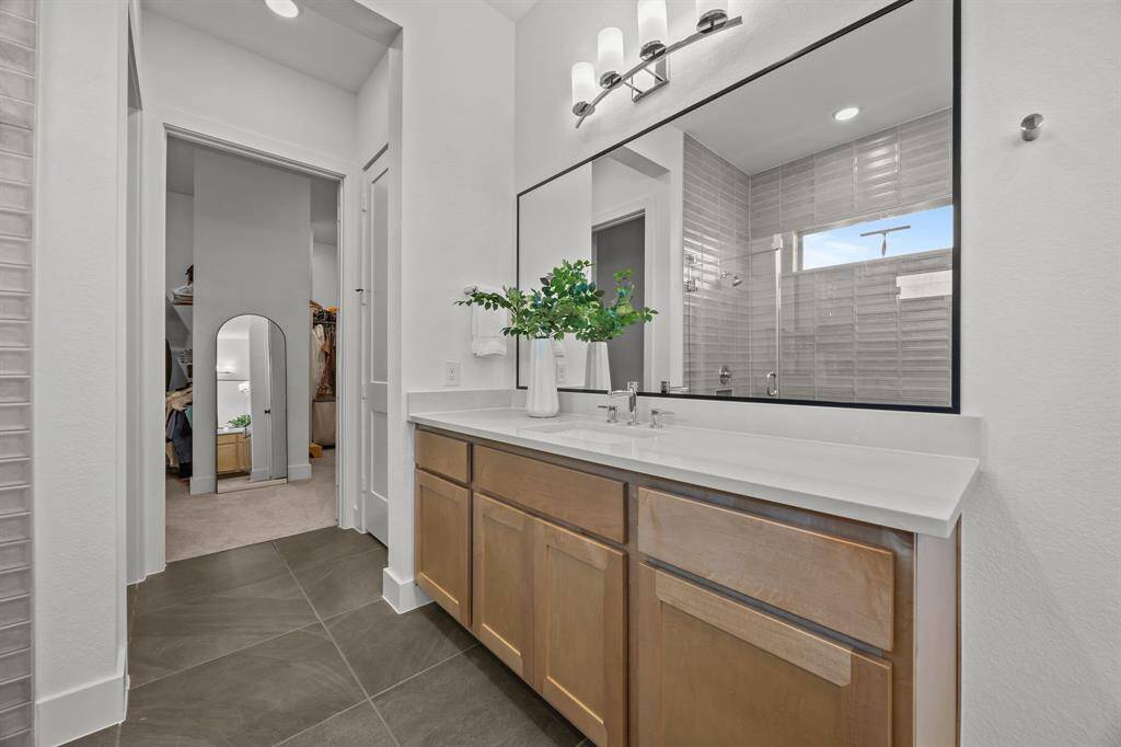These shaker-style cabinets and modern finishes make clutter a thing of the past with ample storage and counter space.