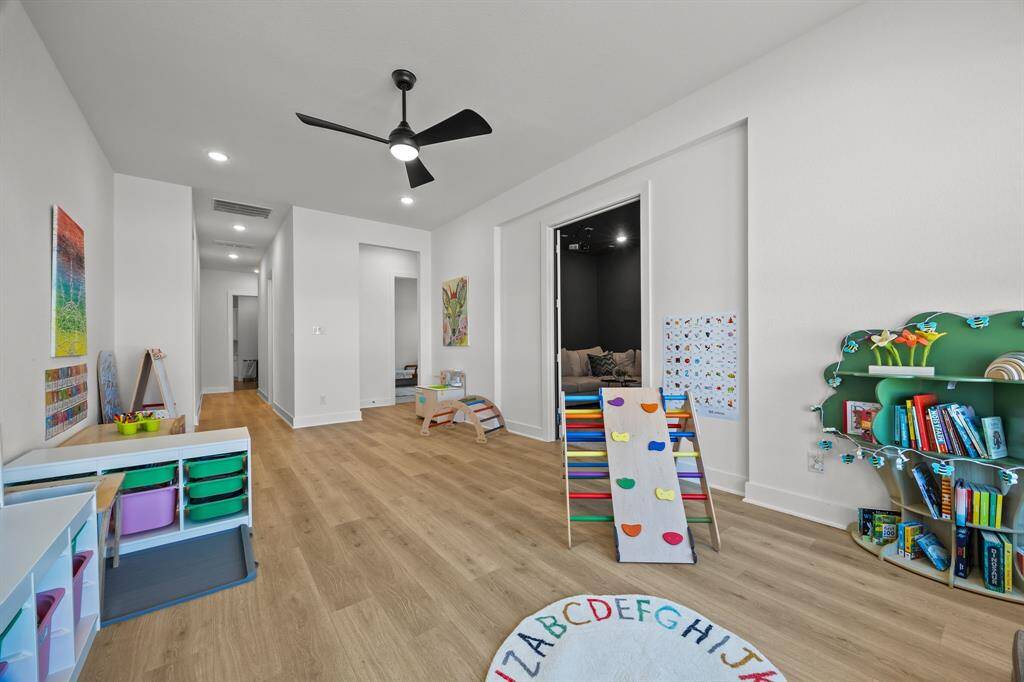 A vast game room designed to cater to all ages, featuring versatile space for various activities.