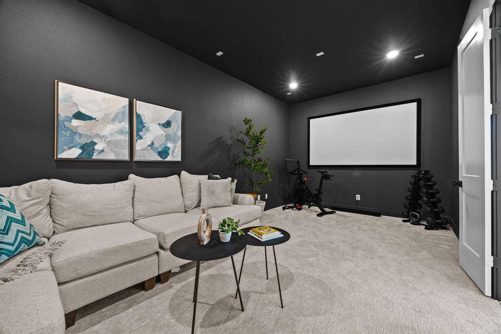 Just off the game room you will find your own private home theater; complete with projector and screen.