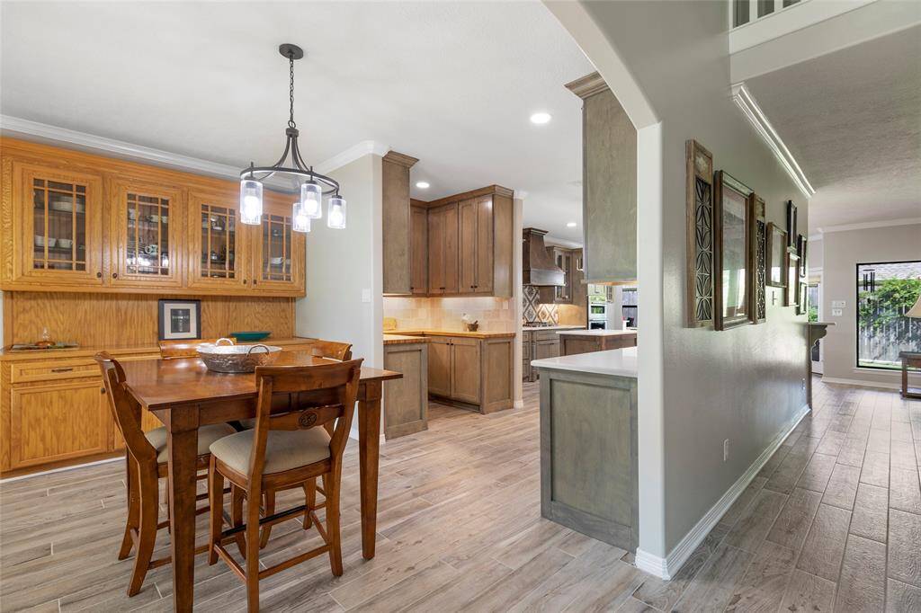The open space between the dining room and kitchen keeps guests included in conversation and the flow of the party continuous.