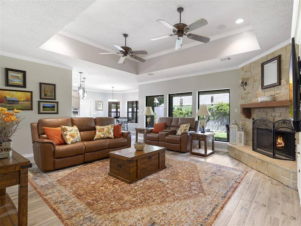 The perfect family room setup right off the kitchen and breakfast area - stay in the dinner conversation while you relax on the couch.