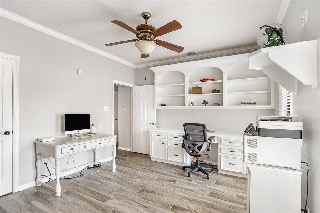 Large built-in shelving over the desk makes displaying accolades or storing books a breeze.