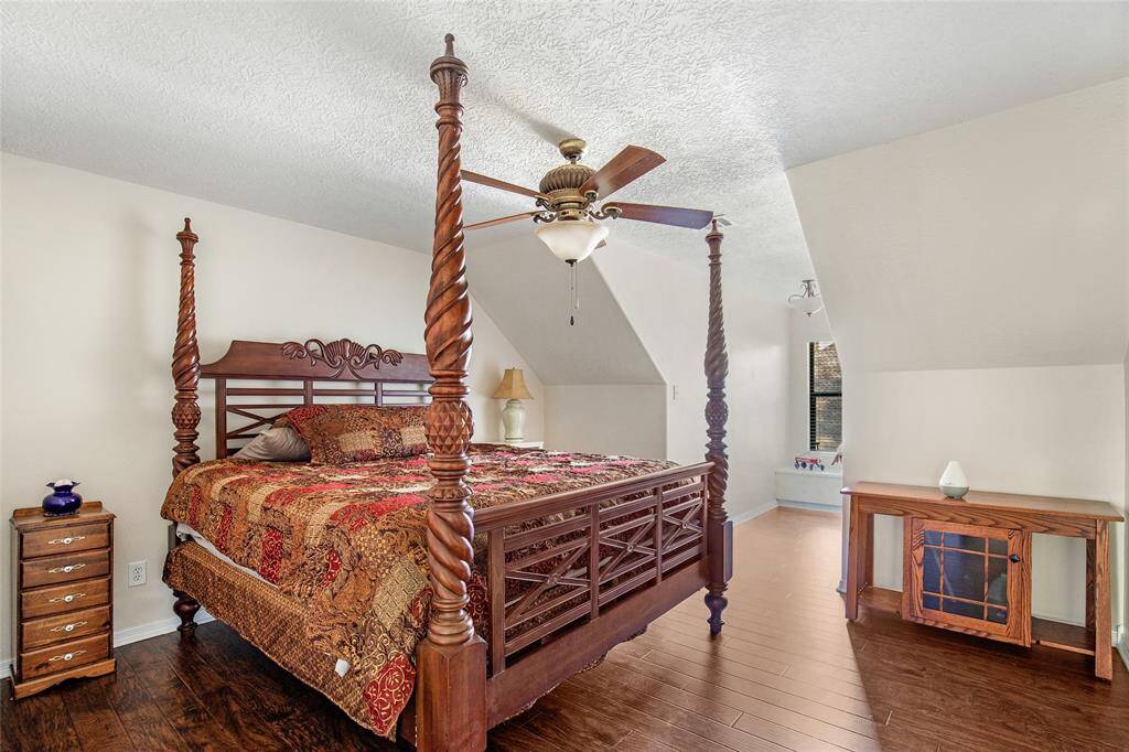 Cozy up in this charming bedroom with a plush bed, stylish decor, and a perfect nook for relaxation or work.