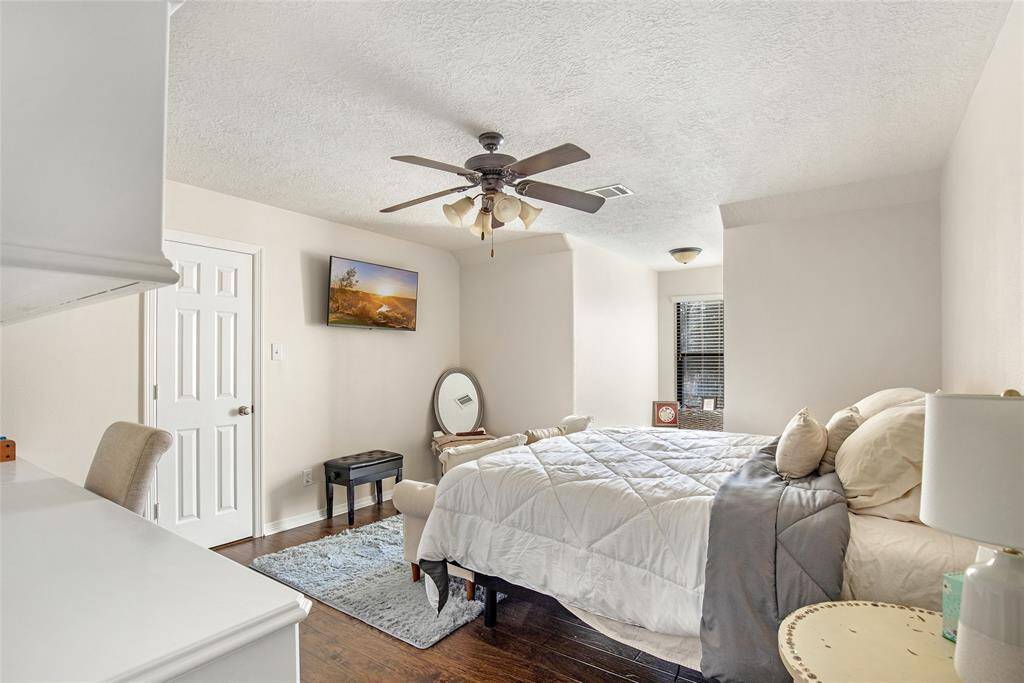 Beautiful guest bedroom with more built-ins and a reading nook.