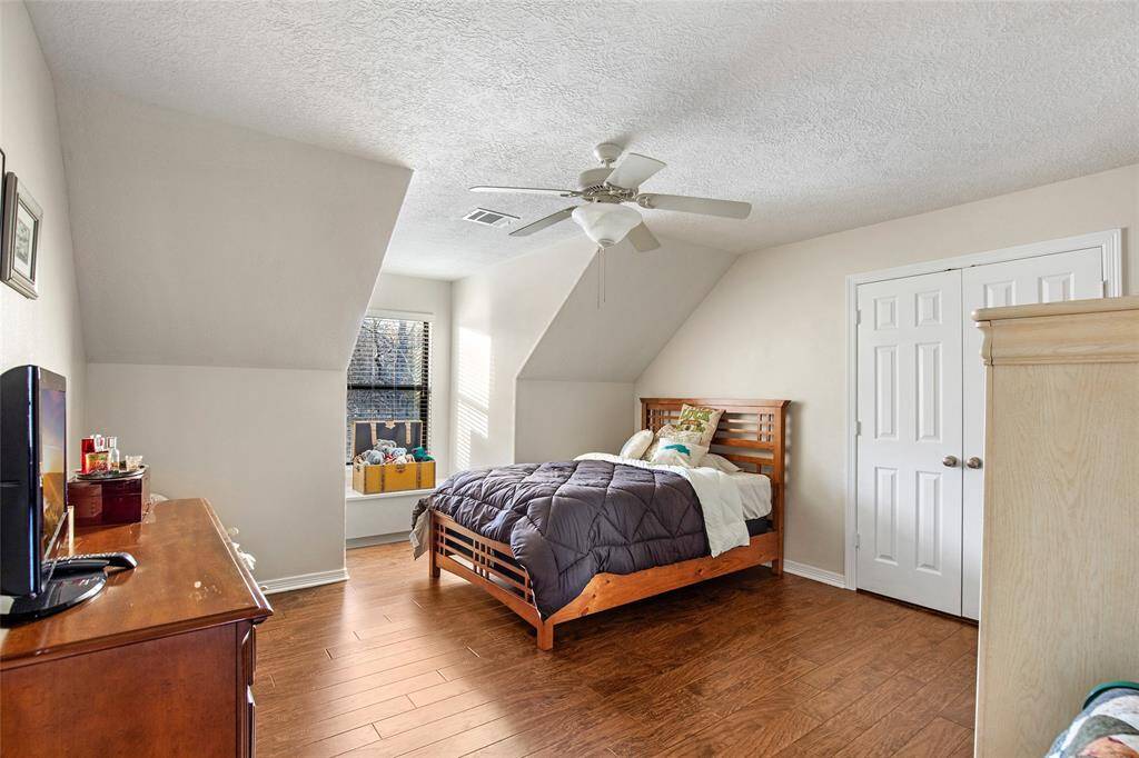A third guest bedroom upstairs holds lots of room for your guests or a large family. You can enjoy privacy in your primary retreat downstairs while your guests have their space in the upstairs!