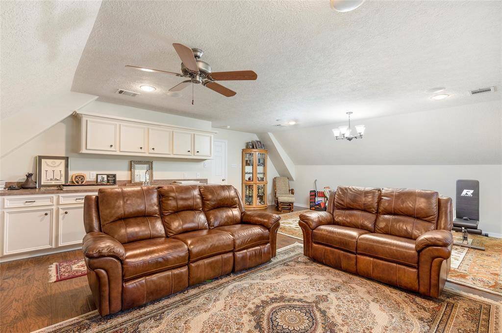 There is still room for an oversized couch set in the game room, perfect for a home theater setup!