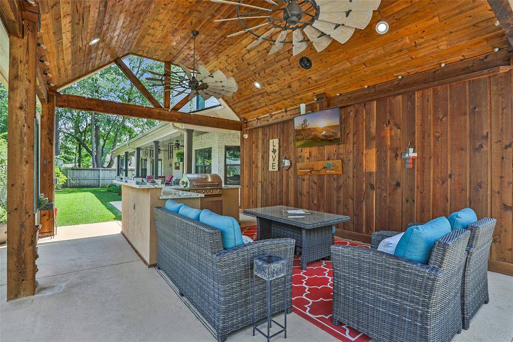 This home not only comes with a custom kitchen, but an outdoor kitchen and entertaining area perfect for indoor/outdoor hosting.