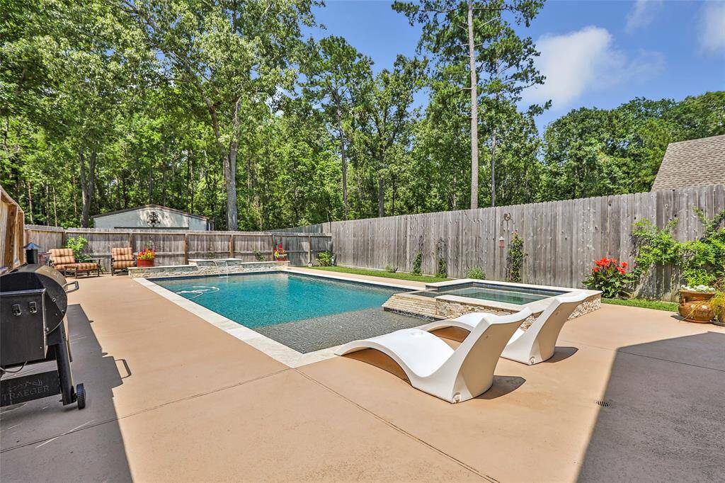 Enjoy the sun with friends and family in this custom pool!