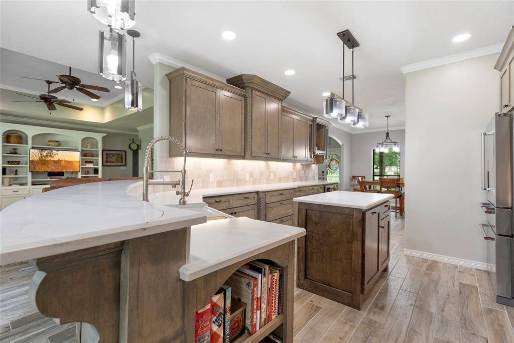 Don't forget the cookbooks! This kitchen not only has endless counter space, but cookbook storage for every family recipe to be quickly accessed.