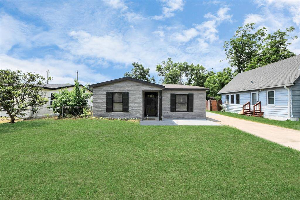 Charming single-story home with a welcoming facade, featuring a manicured lawn and a concrete driveway. The exterior is complemented by mature trees and neighboring homes, creating a cozy suburban feel.