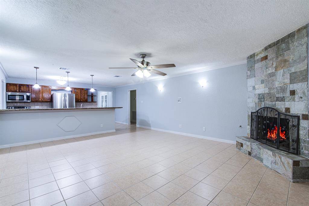 Another view of the open-concept kitchen and living area