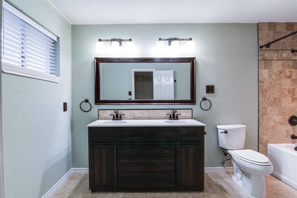 Updated primary bathroom with double sinks and all new fixtures