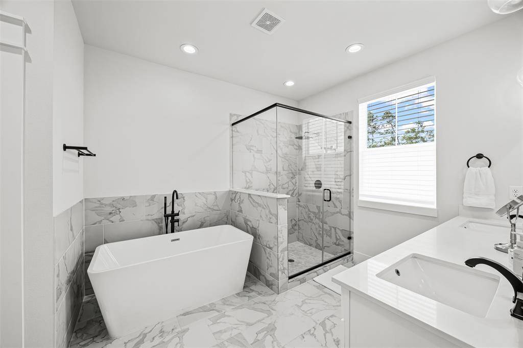 Primary suite bathroom with large soaking tub