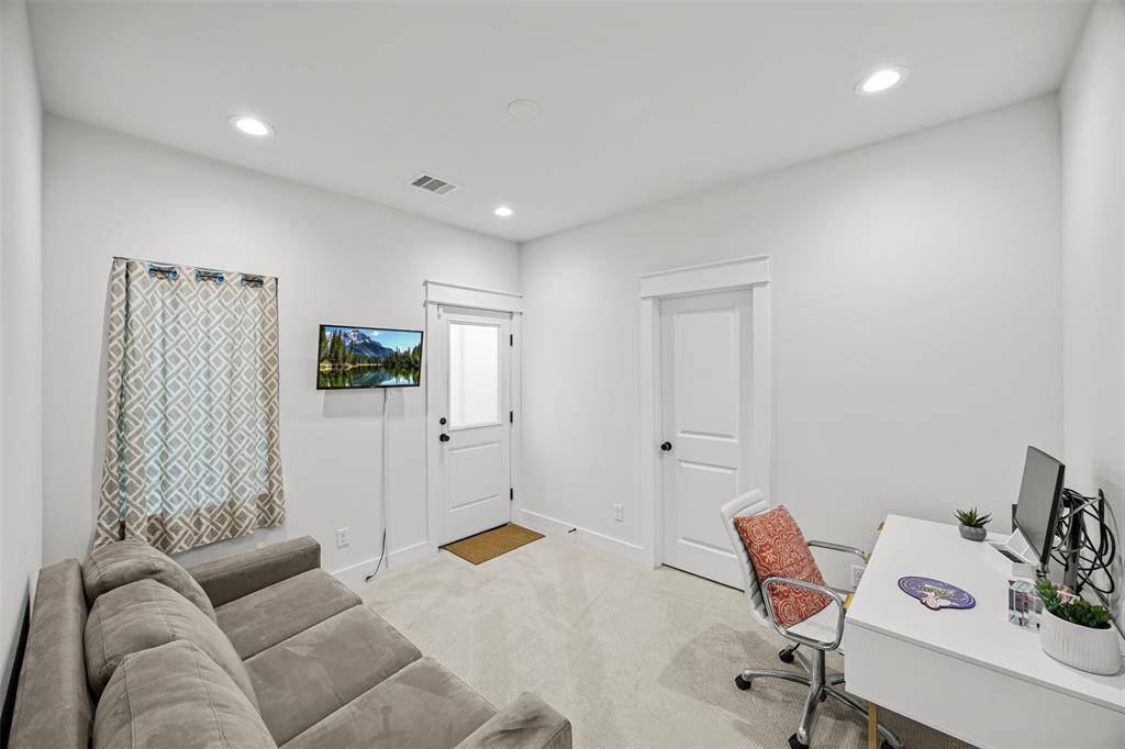 First floor bedroom with en suite bathroom and back yard access