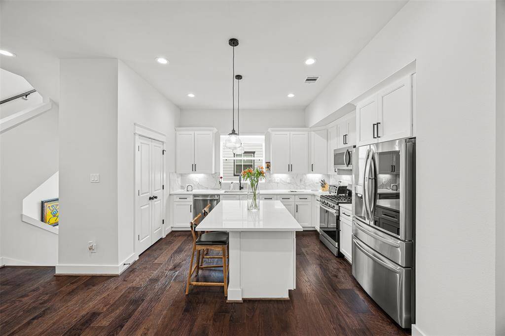 Gorgeous kitchen with tons of natural light and under cabinet lighting
