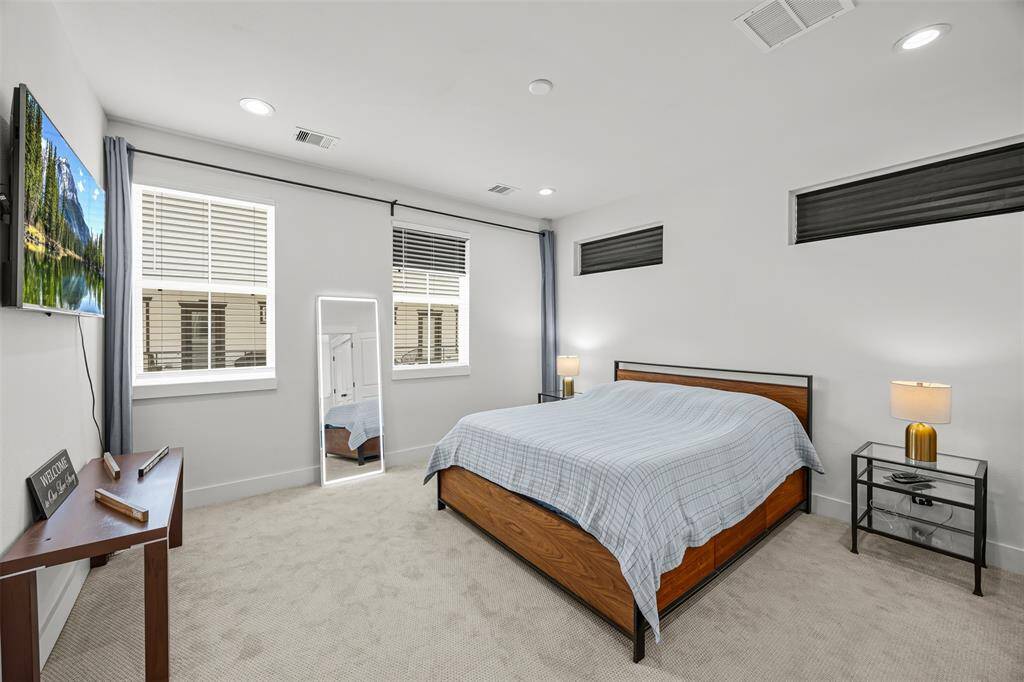 Primary bedroom with tons of natural light