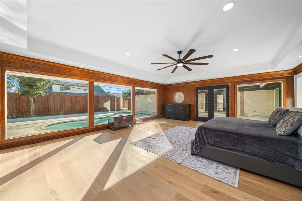 primary bedroom with pool view