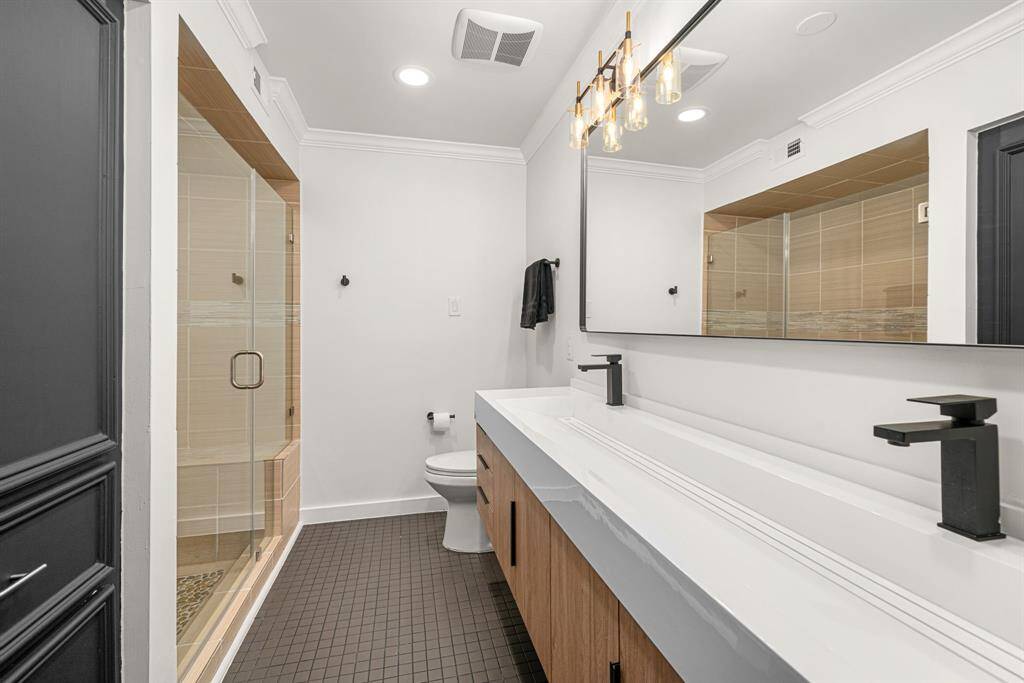 Guest bathroom with floating double vanity and spa like shower