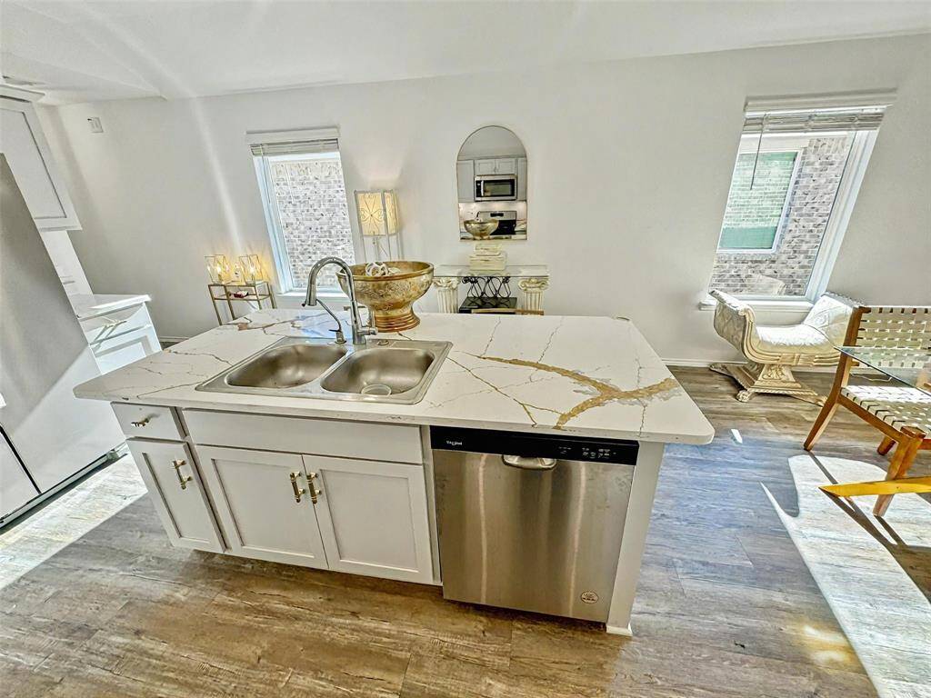 Sophisticated kitchen with sleek finishes and modern fictures.