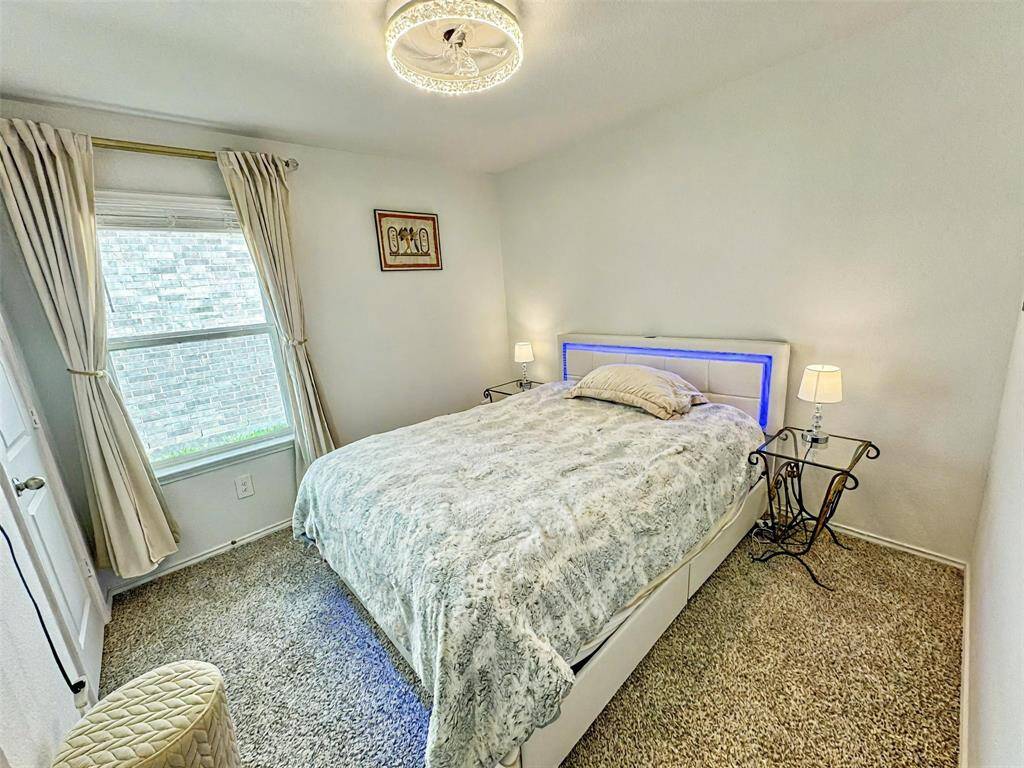 Guest bedroom, includes cream velvet luxry drapes and Sunzero blackout curtains on double rods in primary and guest bedroom!