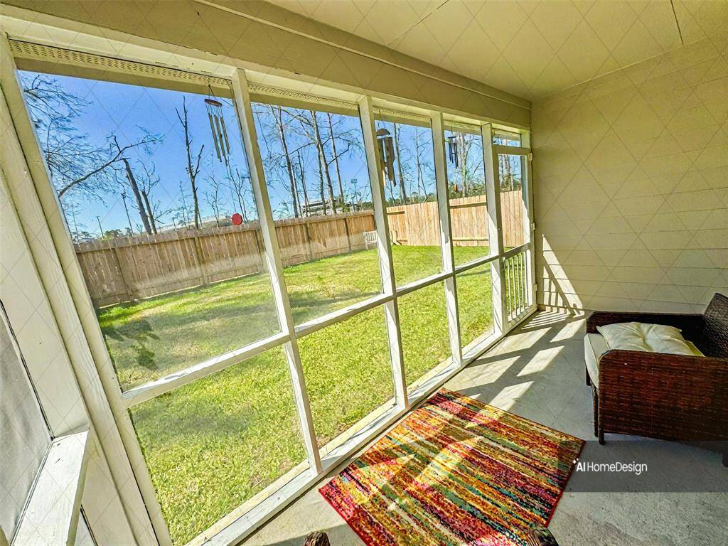 Luxurious enclosed porch with large windows offering a perfect spot for relaxation and enjoying morning coffee or evening apertif.